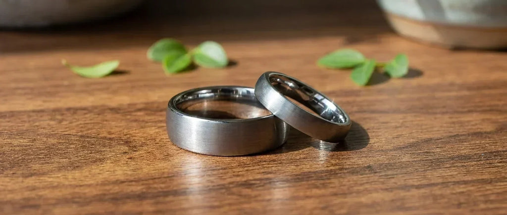 Matching wedding rings for a couple, different widths, same finish